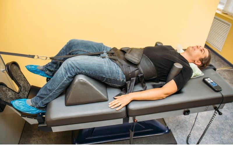 man for her nonsurgical spinal decompression therapy
